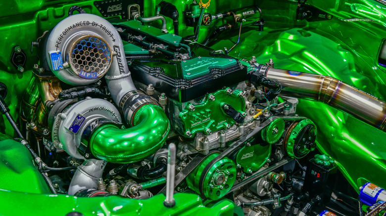 Turbocharged engine in green engine bay