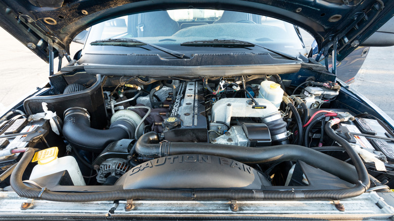 A Ram diesel truck with the hood open showing the engine bay