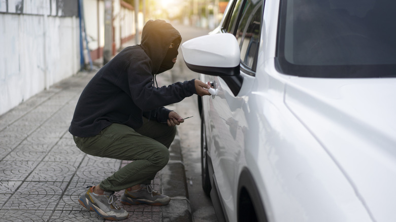 Person attempting to steal a car