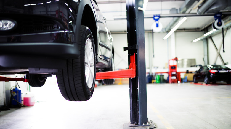 Car on lift at car service