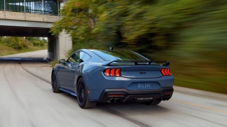 Blue Mustang GT driving fast