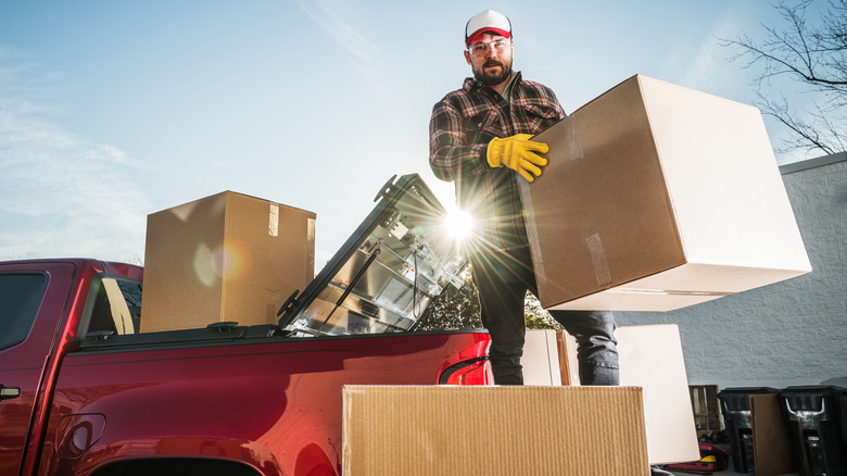 Man unloading boxes from a truck