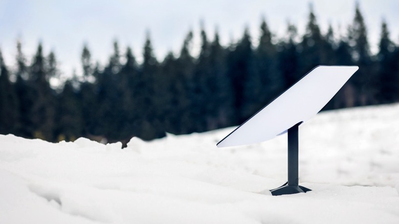 Starlink dish sitting in the snow