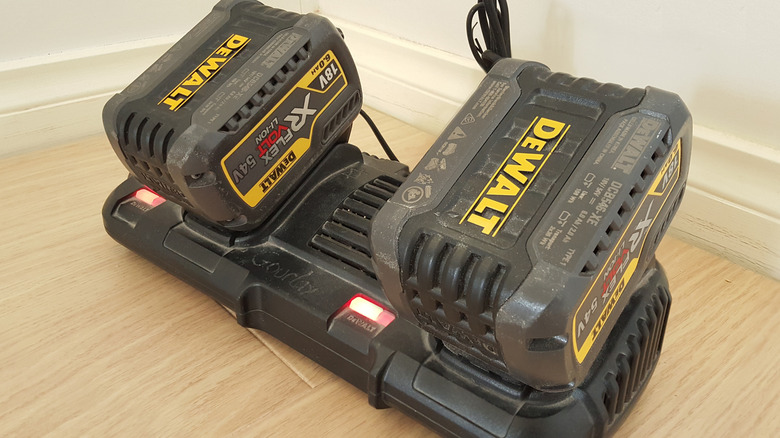 DeWalt batteries attached to a double charger.