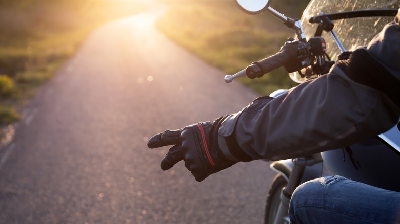 Close up of gesture by motorcyclist