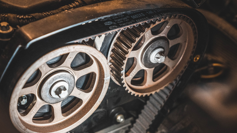 Engine timing belt on cam and crankshaft gears