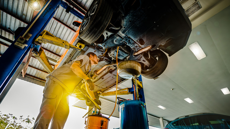 Mechanic Changing Oil