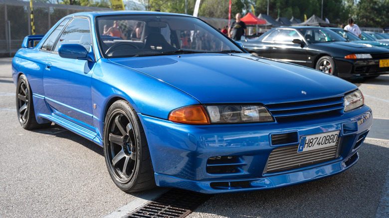 Nissan R32-generation Skyline GT-R aka Godzilla parked at outdoor car show