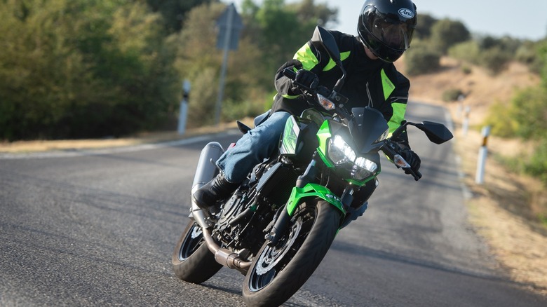 Rider on Kawasaki Ninja 400 negotiating a curve