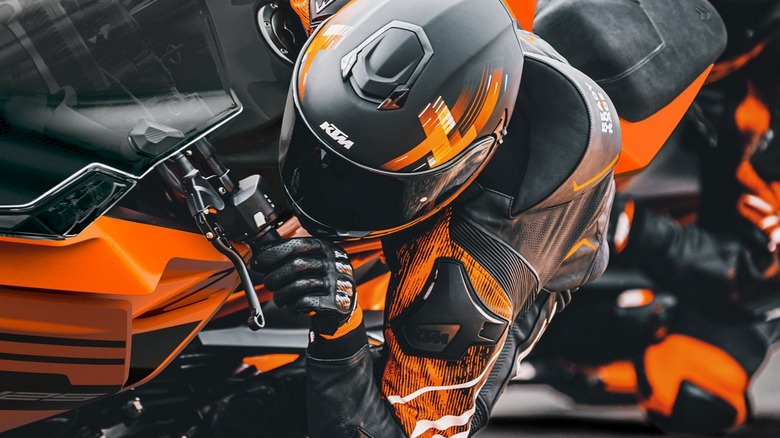 Person Turning on KTM sport motorcycle
