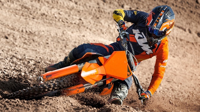 Person turning on KTM dirt bike