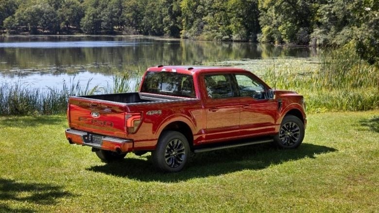 Rear of a 2024 Ford F-150 Lariat next to lake