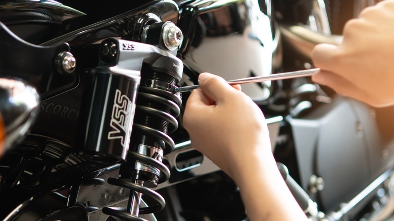 Close-up of a technician fixing a bike