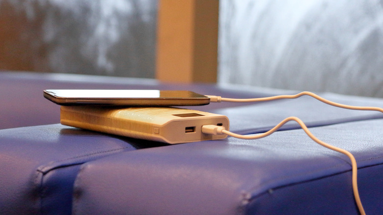 portable phone charger on bed