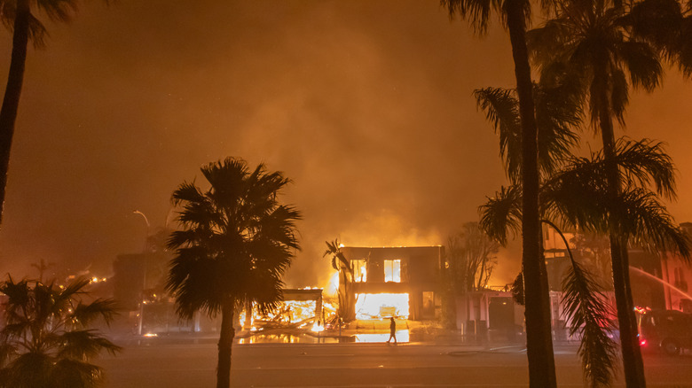 California wildfire burning structure