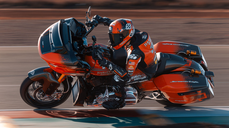 A racer speeds through a turn on a Harley-Davidson CVO Road Glide RR.