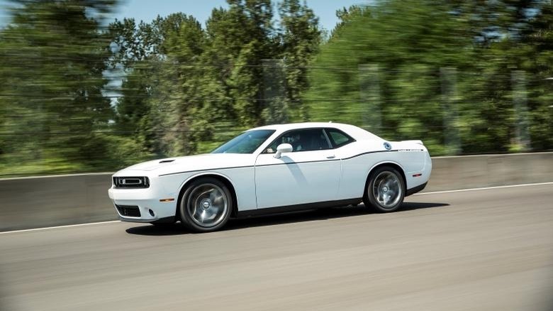 Action shot of a white 2015 Dodge Challenger SXT Plus