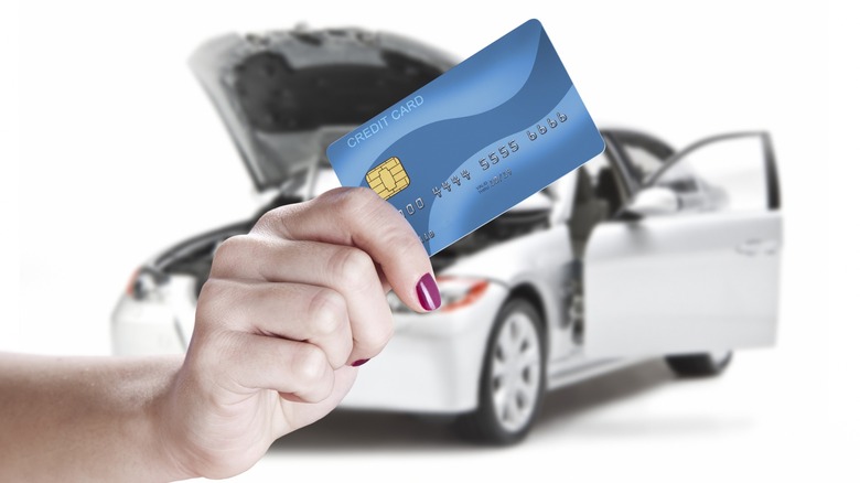 Person paying for auto repairs