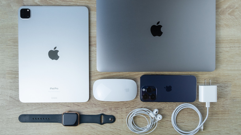 Several Apple products laid out on a table