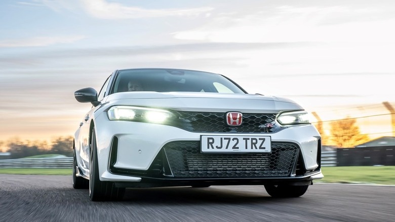 The front of a Honda Civic Type R shows off its red logo