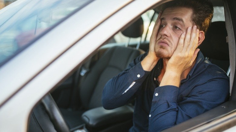 A driver frustrated after hearing strange sounds coming from their car