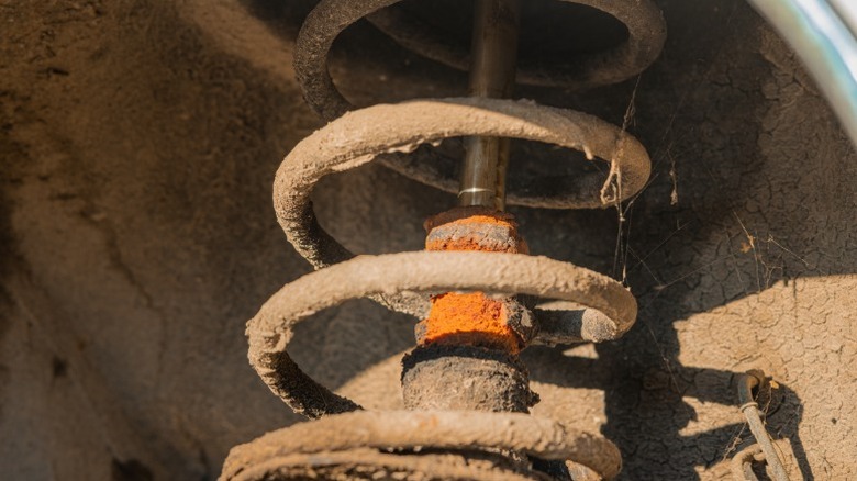 A closeup image of old, worn-out car shocks