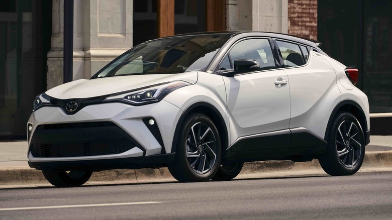 Toyota CH-R parked on the roadside in front of a building