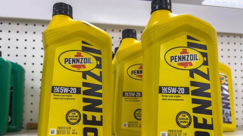 several pennzoil 5w-20 engine oil bottles