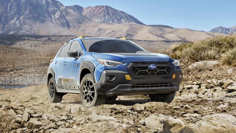 Geyser Blue Subaru Crosstrek Wilderness driving off-road