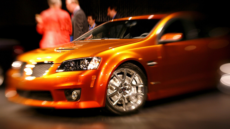 Orange Pontiac G8 chrome wheels