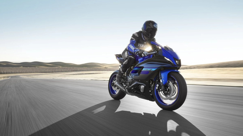 Person riding blue Yamaha R7 motorcycle