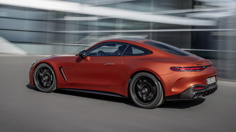 red 2025 Mercedes-AMG GT 63 S E Performance driving on road