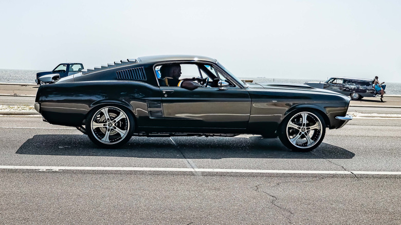 dark painted custom 1967 Ford Mustang fastback