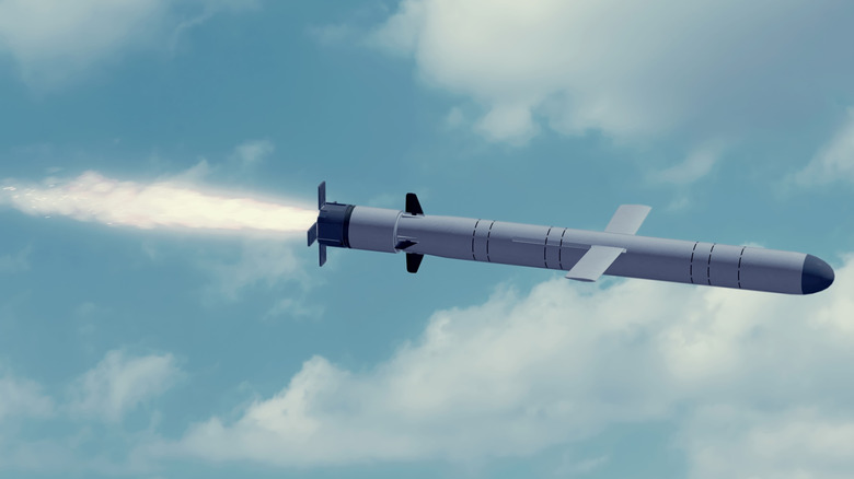 A Kalibr missile in flight above clouds.