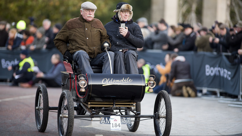 Antique Oldsmobile General Motors GM car displayed in parade