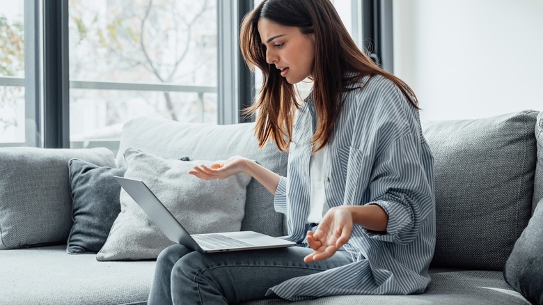 woman frustrated at laptop