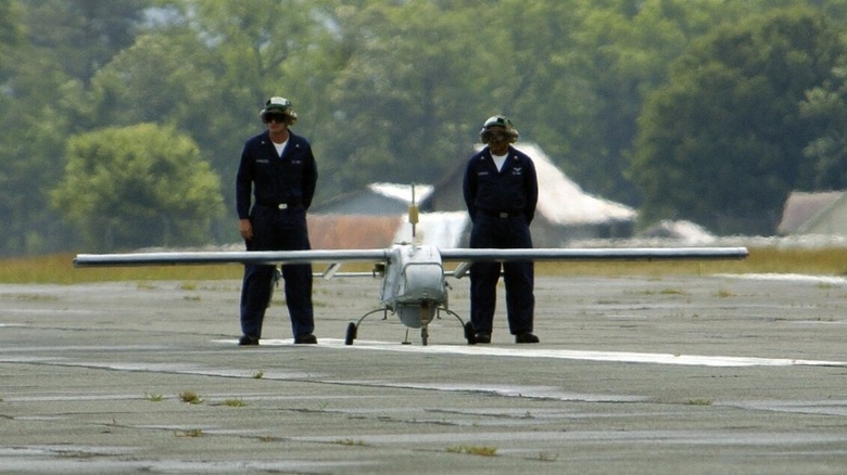 Two personnel with an RQ-2B Pioneer