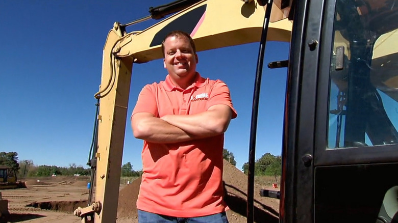 Randy standing confidently in front of construction zone