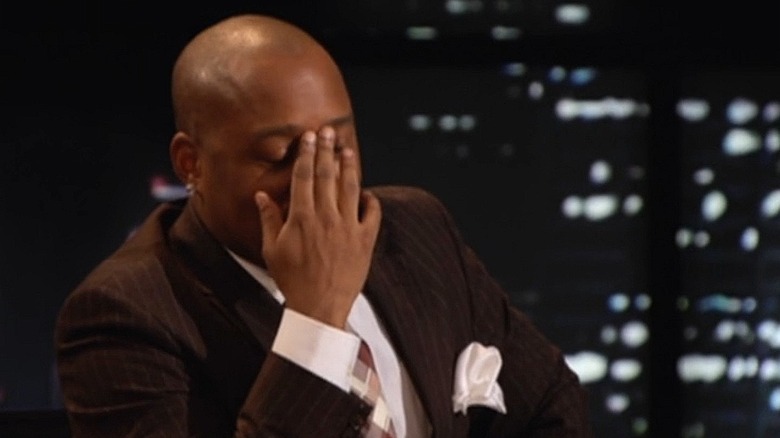 Daymond John facepalming on Shark Tank during Ionic Ear presentation