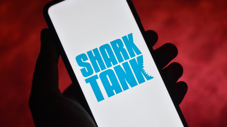 Shark Tank TV show logo on smartphone in someone's hand