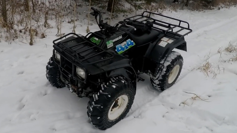 Kawasaki bayou 4x4 in snow