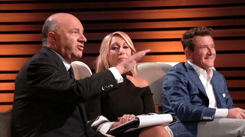 Kevin O'Leary, Lori Greiner, and Robert Herjavec listen to the Saucemoto pitch on Shark Tank