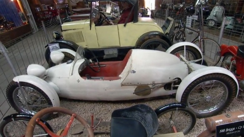 White belly tank cycle car from American Pickers when it was at Pioneer Auto Show in Murdo, South Dakota.