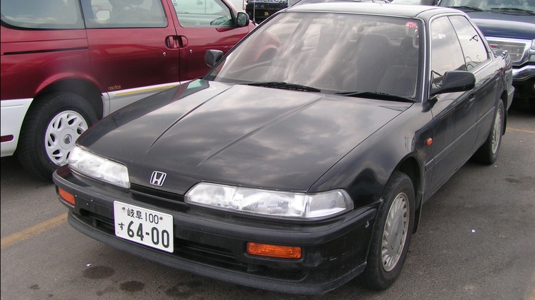 Black Honda Integra XSi sedan front end