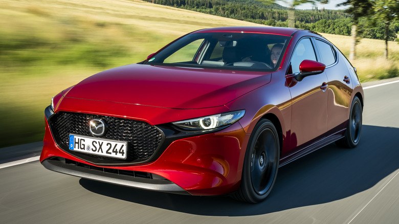 Mazda3 Skyactiv-X hatchback driving on country road