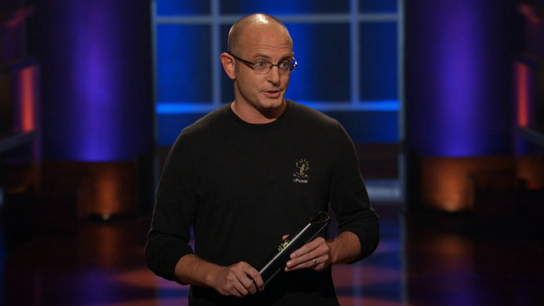 Aaron holding nPower PEG on Shark Tank