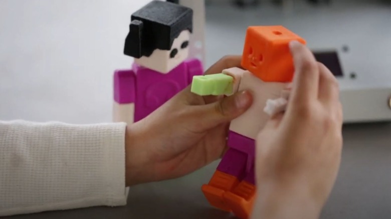 3D printed toys from the Toybox printer being played with.