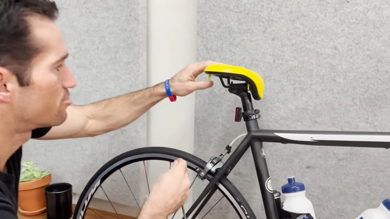 Man adjusting a VSEAT bicycle seat