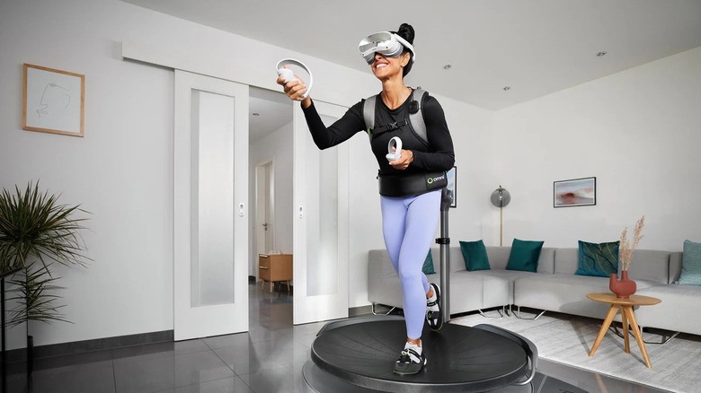 Woman playing with Virtuix Omni at home while smiling