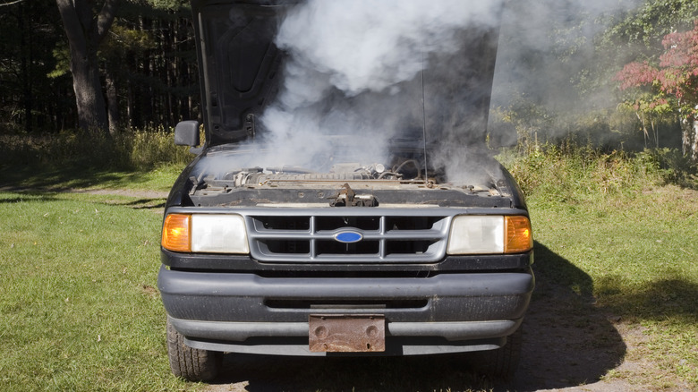 Front of car with overheated engine